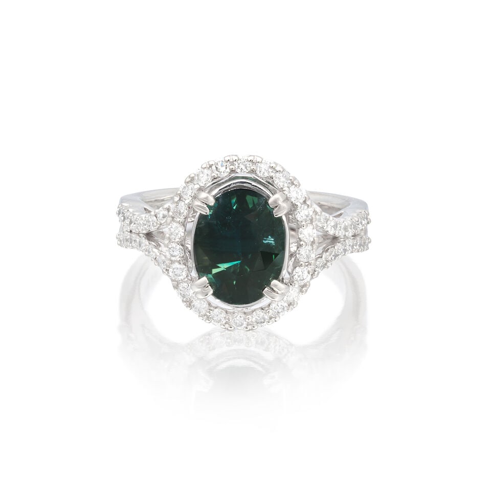 HARLE PARIS: SAPPHIRE AND DIAMOND RING: HARLE PARIS: SAPPHIRE AND DIAMOND RING Oval-cut sapphire Brilliant-cut diamonds 0.45ct total 18 carat gold UK hallmark Ring size approx. L Weight approx. 6.0g Footnotes: OVERALL CONDITION Light surfac