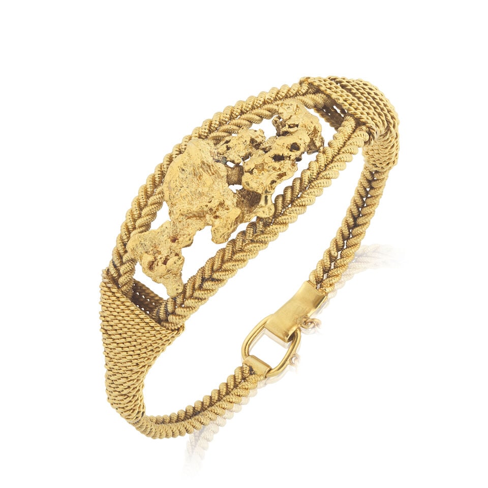 ROPETWIST AND NUGGET BRACELET: ROPETWIST AND NUGGET BRACELET Central nugget motif Inner circumference approx. 17.0cm Weight approx. 38.0g Footnotes: OVERALL CONDITION Some wear to unhallmarked yellow metal testing as 22kt gold.