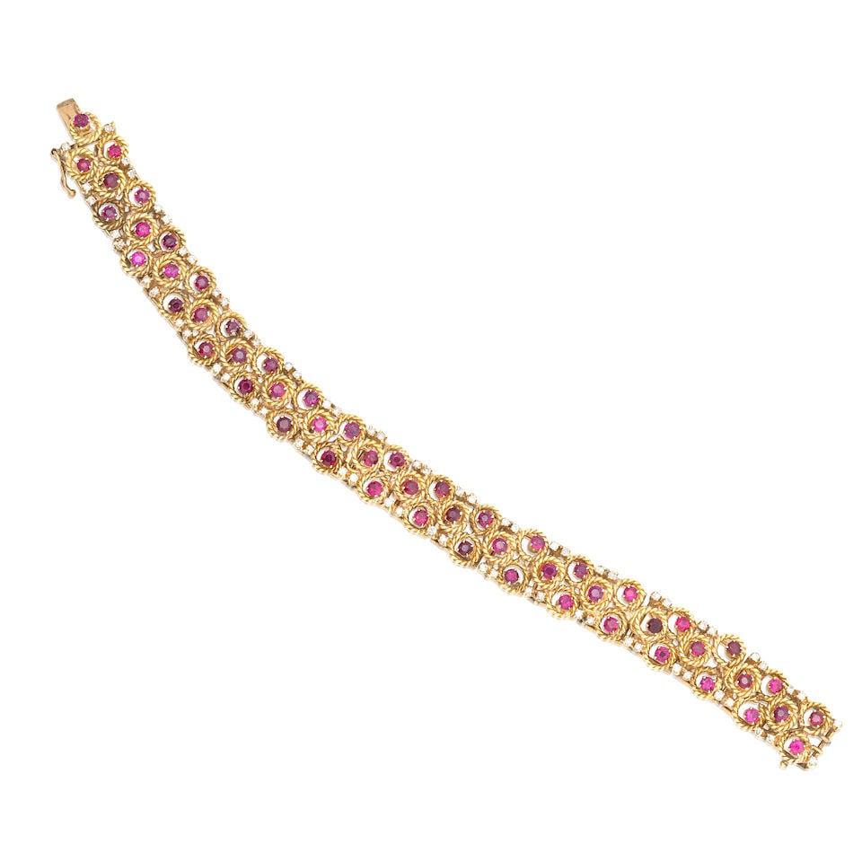 DIAMOND AND RUBY BRACELET: DIAMOND AND RUBY BRACELET Single-cut diamonds approx. 0.70ct total Circular-cut rubies Length 18.5cm Weight approx. 39.5g Footnotes: OVERALL CONDITION Light surface wear to unhallmarked metal stamped