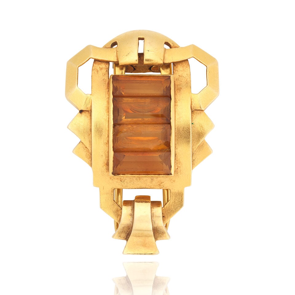 GAZDAR: CITRINE CLIP BROOCH, CIRCA 1945: GAZDAR: CITRINE CLIP BROOCH, CIRCA 1945 Step-cut citrines Signed Gazdar Length 3.7cm Weight approx. 14.5g Footnotes: Gazdar was founded in 1933 by brothers Rusi and Dinshah Gazdar. Their boutique was 