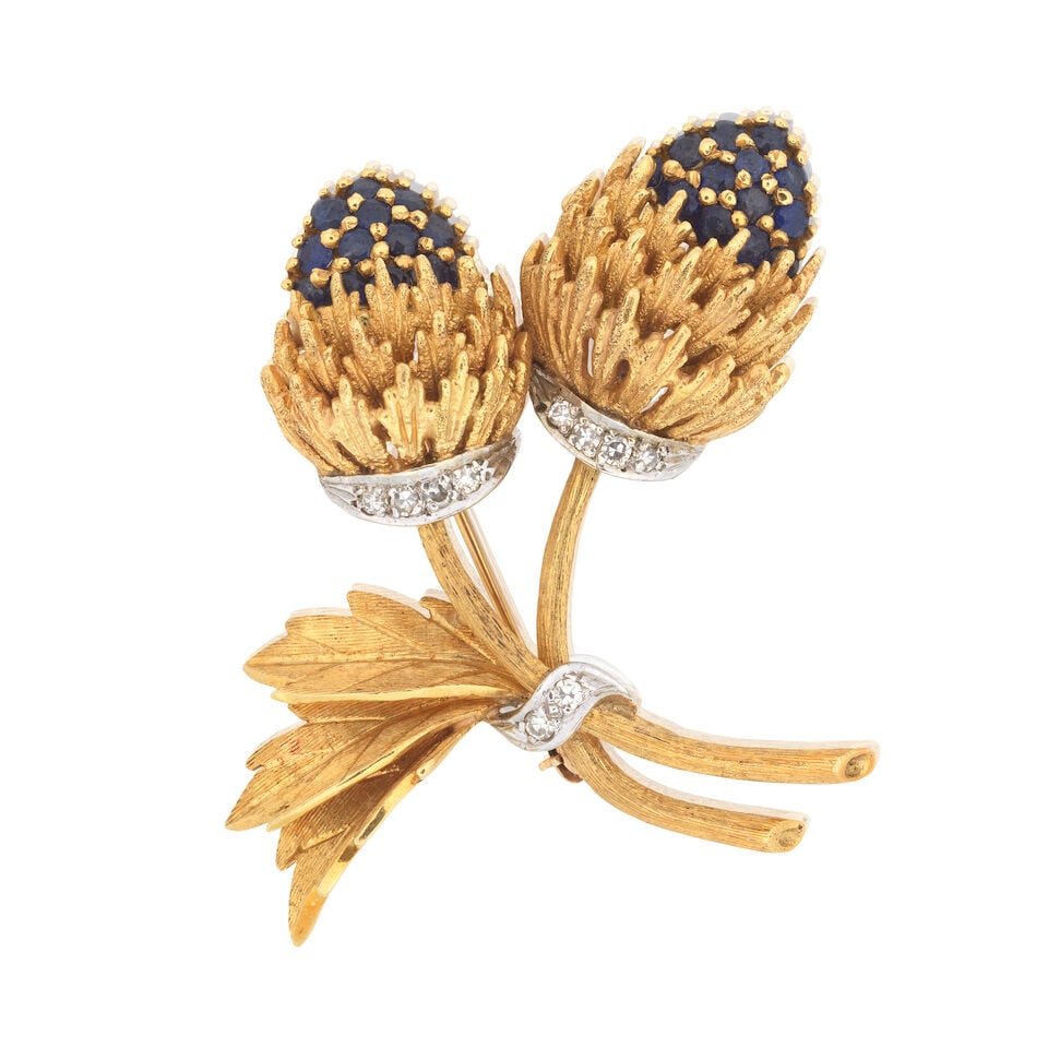 SAPPHIRE AND DIAMOND-SET THISTLE BROOCH: SAPPHIRE AND DIAMOND-SET THISTLE BROOCH Circular-cut sapphires Single-cut diamonds Length 4.5cm Weight approx. 19.0g Footnotes: OVERALL CONDITION Light surface wear to unhallmarked metal stamped to