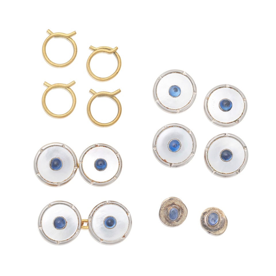 SAPPHIRE AND MOTHER-OF-PEARL DRESS SET: SAPPHIRE AND MOTHER-OF-PEARL DRESS SET Comprising of four buttons, pair of cufflinks and two studs Sapphire cabochons Mother-of-pearl inlays Plaque length 1.3cm Weight approx. 12.5g Cased by Connard