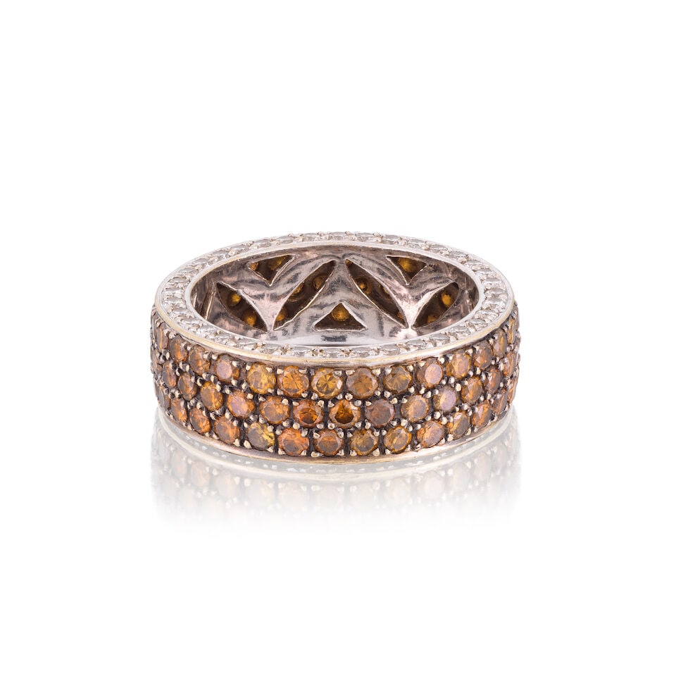 ADLER: COLOURED DIAMOND AND DIAMOND ETERNITY RING: ADLER: COLOURED DIAMOND AND DIAMOND ETERNITY RING Brilliant-cut coloured diamonds approx. 1.95cts total Brilliant-cut diamonds approx. 0.70ct total Signed Adler Ring size approx. M½ Width