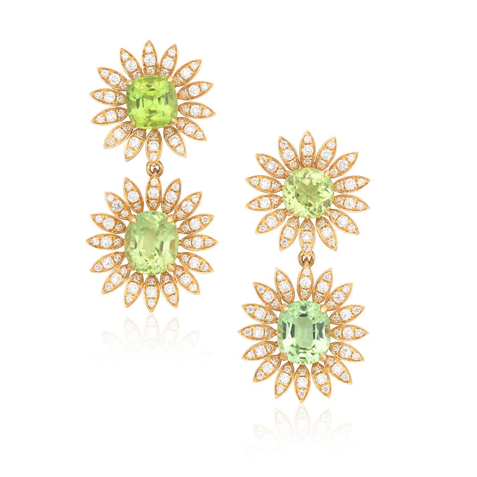 PERIDOT AND DIAMOND FLOWER EARRINGS: PERIDOT AND DIAMOND FLOWER EARRINGS Cushion-cut peridots Brilliant-cut diamonds approx. 0.70cts total 14 carat gold UK hallmarks Length 3.5cm Weight approx. 9.5g Footnotes: OVERALL
