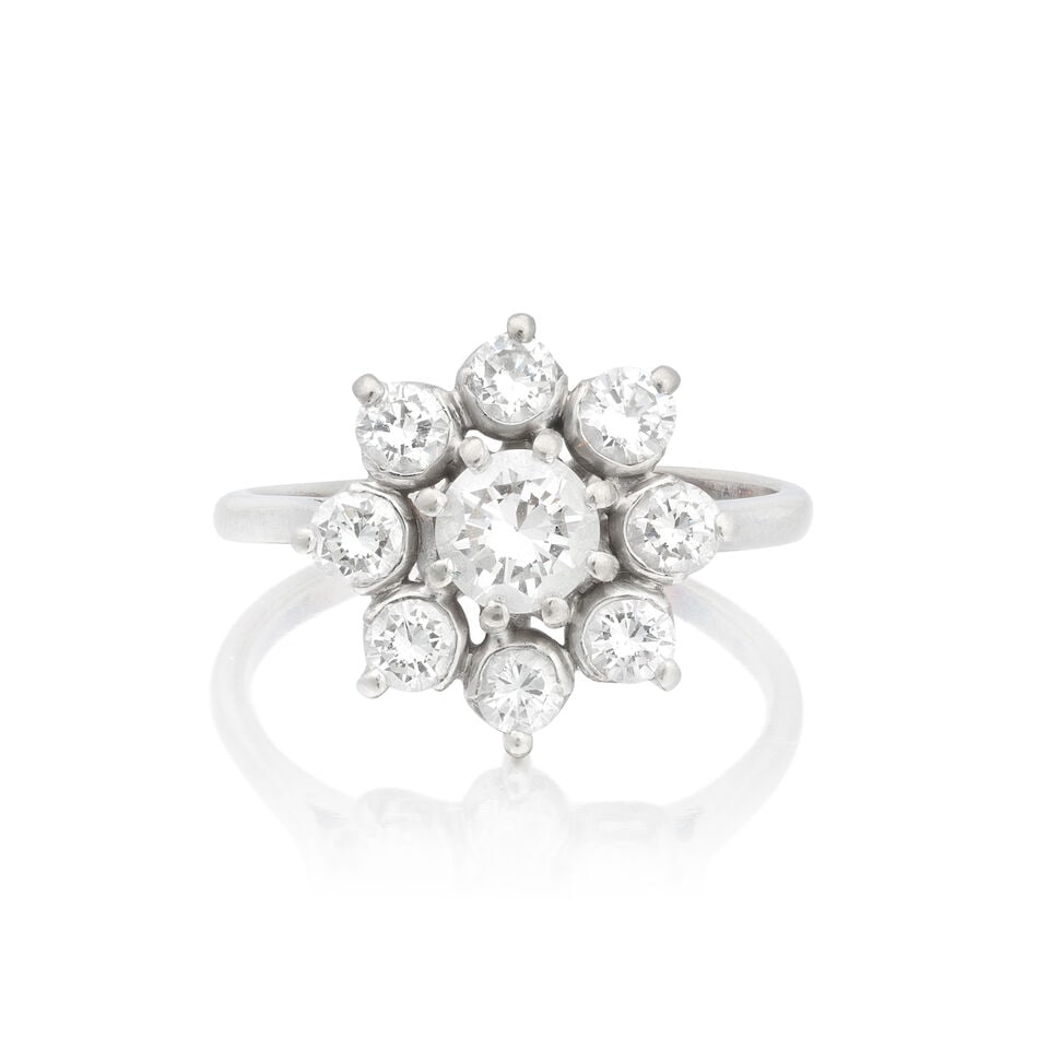 DIAMOND CLUSTER RING: DIAMOND CLUSTER RING Brilliant-cut diamonds approx. 1.30cts total Ring size approx. N½ Weight approx. 4.5g Footnotes: OVERALL CONDITION Some surface wear to unhallmarked white metal testing as