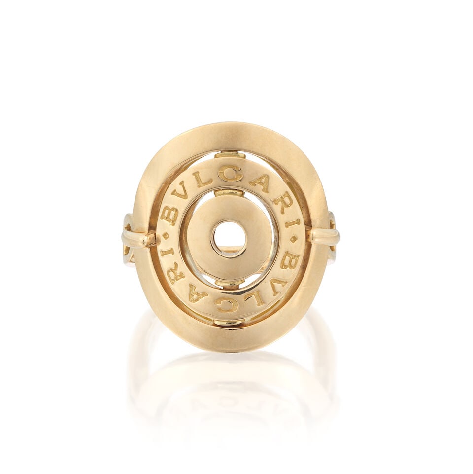 BULGARI: 'ASTRALE CERCHI' RING: BULGARI: 'ASTRALE CERCHI' RING With linked movement Signed Bulgari Ring size approx. K, plaque length 2.0cm Weight approx. 11.5g Footnotes: OVERALL CONDITION Light surface wear, very light scratches,