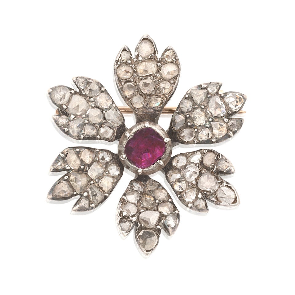 RUBY AND DIAMOND FLOWER PENDANT/BROOCH, CIRCA 1800: RUBY AND DIAMOND FLOWER PENDANT/BROOCH, CIRCA 1800 The cushion-cut ruby to petals of rose-cut diamonds, within closed back settings, mounted in silver, later brooch fitting, length 2.9cm For further