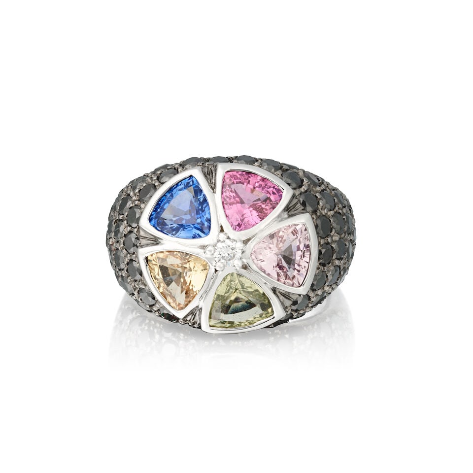 TRIO: SAPPHIRE AND BLACK DIAMOND RING: TRIO: SAPPHIRE AND BLACK DIAMOND RING Triangular-cut vari-coloured sapphires Brilliant-cut black diamonds Signed Trio Ring size approx. K Weight approx. 10.0g Footnotes: OVERALL CONDITION Very light