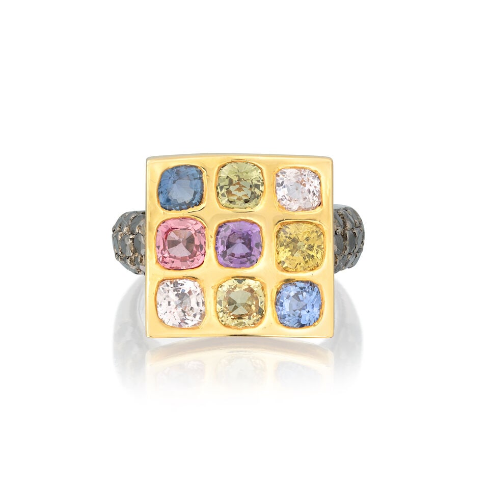 TRIO: SAPPHIRE AND BLACK DIAMOND RING: TRIO: SAPPHIRE AND BLACK DIAMOND RING Cushion-cut vari-coloured sapphires Brilliant-cut black diamonds Signed Trio Ring size approx. K½, plaque length approx. 1.4cm Weight approx.