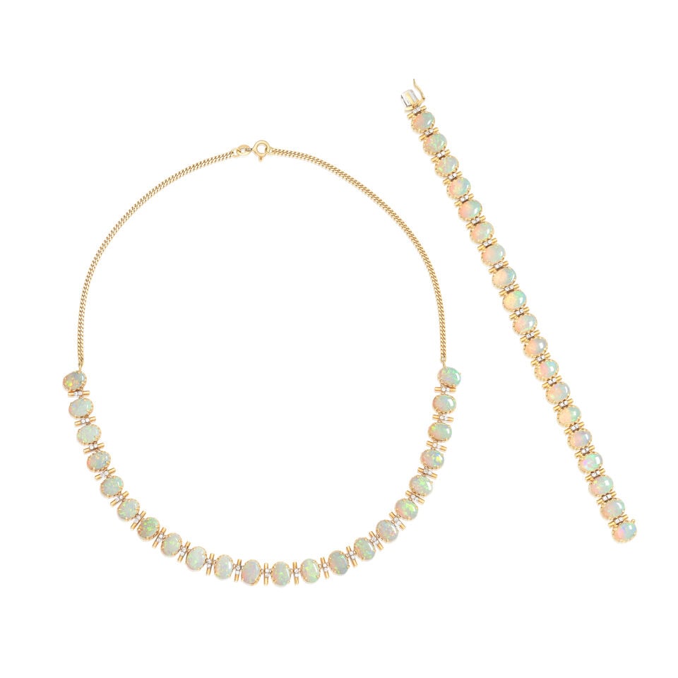 OPAL AND DIAMOND NECKLACE AND BRACELET: OPAL AND DIAMOND NECKLACE AND BRACELET Opal cabochons Brilliant-cut diamonds approx. 0.75ct total 18 carat gold London hallmark and import mark Necklace length 43.5cm, bracelet length 17.0cm Weight