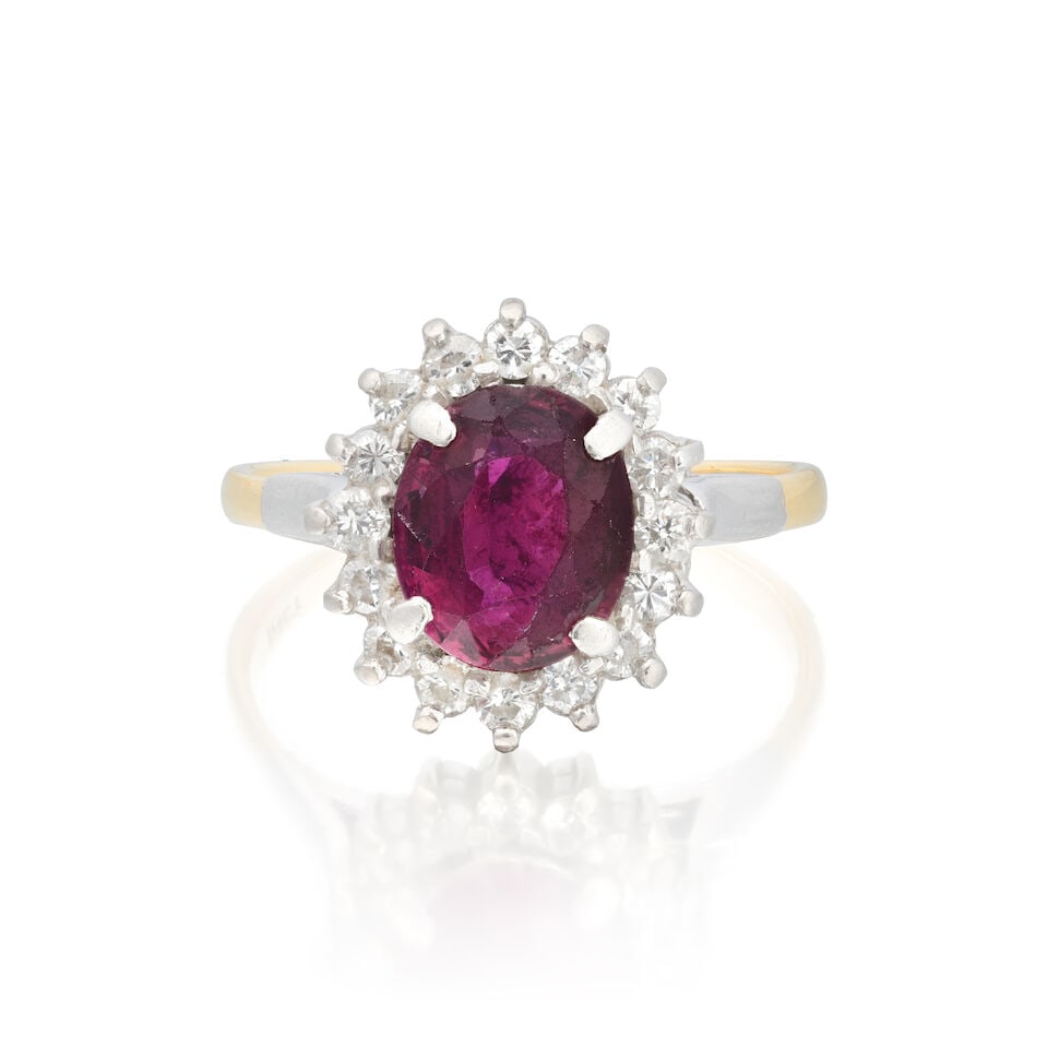 RUBY AND DIAMOND CLUSTER RING: RUBY AND DIAMOND CLUSTER RING Oval-cut ruby Brilliant-cut diamonds approx. 0.30ct total Ring size approx. Q Weight approx. 5.5g Footnotes: OVERALL CONDITION Some light surface wear to unhallmarked