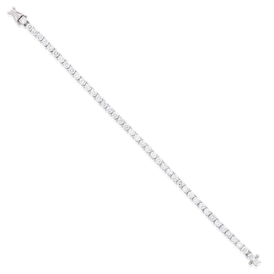 DIAMOND LINE BRACELET: DIAMOND LINE BRACELET Brilliant-cut diamonds 8.09cts total 18 carat white gold London hallmark, Convention mark Length 17.5cm Weight approx. 17.0g Footnotes: Please note, this lot has VAT at the