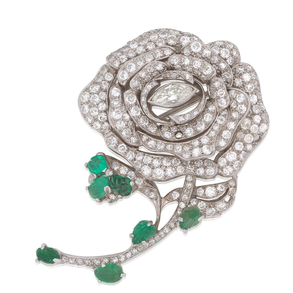 DIAMOND AND EMERALD FLOWER BROOCH: DIAMOND AND EMERALD FLOWER BROOCH Marquise, single and brilliant-cut diamonds approx. 3.50cts total, several deficient Carved emerald cabochons Length approx. 5.0cm Weight approx. 22.0g Footnotes: Pro