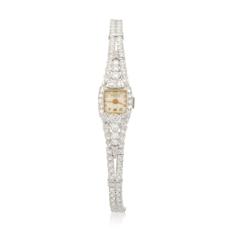 DIAMOND-SET COCKTAIL WATCH: DIAMOND-SET COCKTAIL WATCH Brilliant, single and baguette-cut diamonds approx. 2.05cts total Inner circumference approx. 15.5cm, case length 1.7cm Weight approx. 28.0g Footnotes: OVERALL