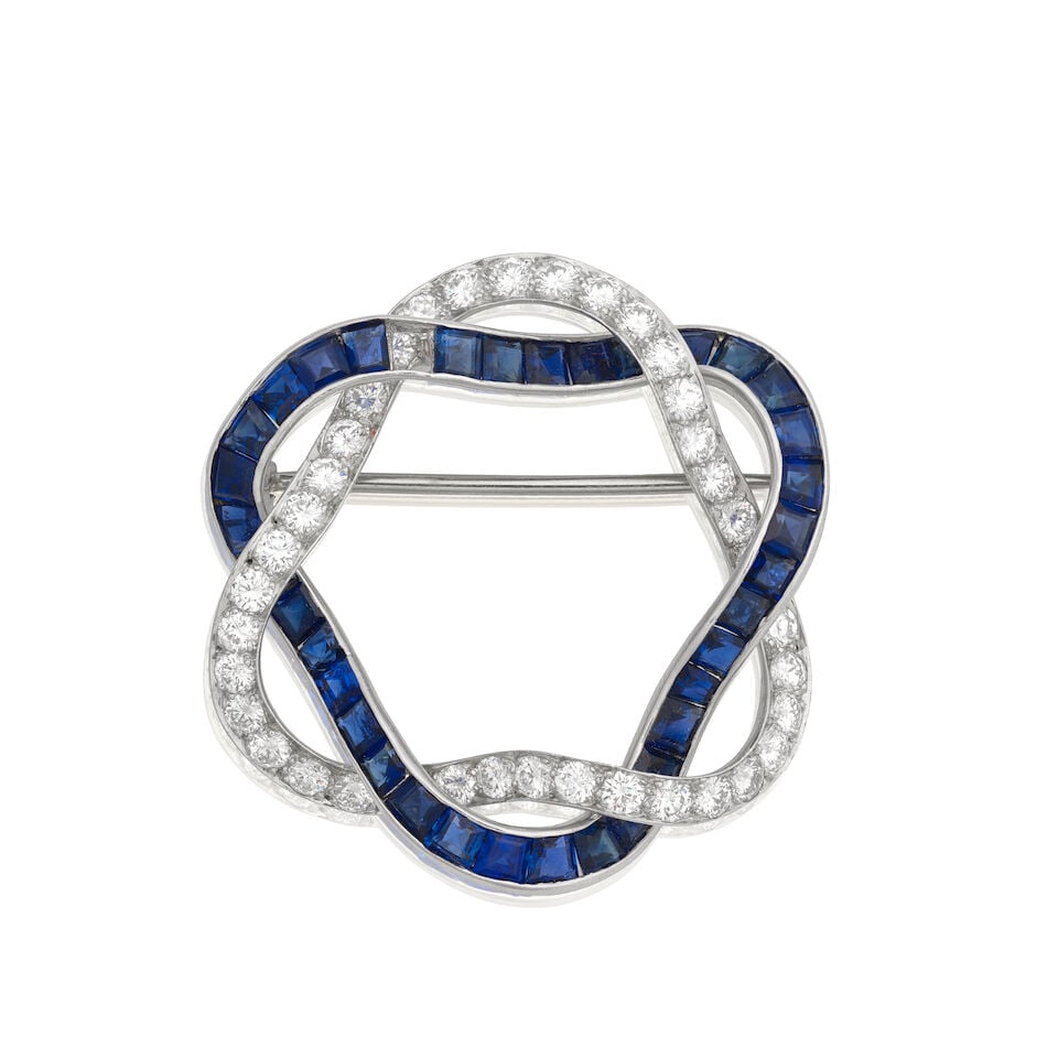 SAPPHIRE AND DIAMOND-SET BROOCH: SAPPHIRE AND DIAMOND-SET BROOCH Calibré-cut sapphires Brilliant-cut diamonds approx. 2.50cts total Length 3.0cm Weight approx. 8.5g Footnotes: Property from a Private Collection OVERALL