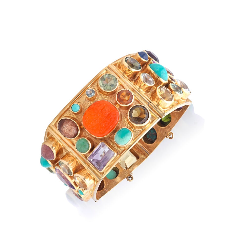 GEM-SET CUFF BRACELET: GEM-SET CUFF BRACELET Including carved carnelian, amethyst, turquoise and citrine and various synthetic gemstones Inner circumference 17.0cm Weight approx. 97.0g Footnotes: OVERALL CONDITION Some