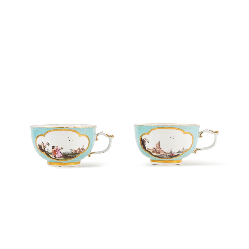 Deux tasses à fond turquoise en porcelaine de Meissen, vers 1740 Two Meissen turquoise-grou...: Deux tasses à fond turquoise en porcelaine de Meissen, vers 1740 Two Meissen turquoise-ground teacups, circa 1740 Both decorated with riverine landscapes with people within quatrelobed