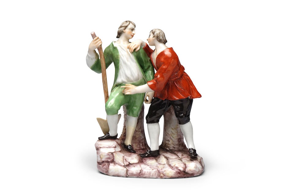 Groupe de bergers en porcelaine de Doccia, vers 1770 A Doccia shepherd group, circa 1770: Groupe de bergers en porcelaine de Doccia, vers 1770 A Doccia shepherd group, circa 1770 Modelled wearing a green and red tunic respectively, one leaning on a staff, on a painted rockwork base, 16.1cm