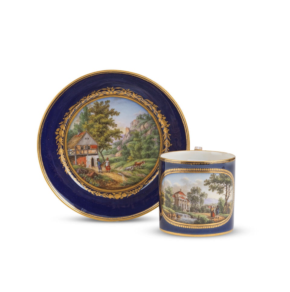 Tasse et soucoupe à fond bleu en porcelaine de Meissen (Marcolini), vers 1800 A Marcolini M...: Tasse et soucoupe à fond bleu en porcelaine de Meissen (Marcolini), vers 1800 A Marcolini Meissen blue-ground cabinet cup and saucer, circa 1800 The cup reserved with a landscape scene