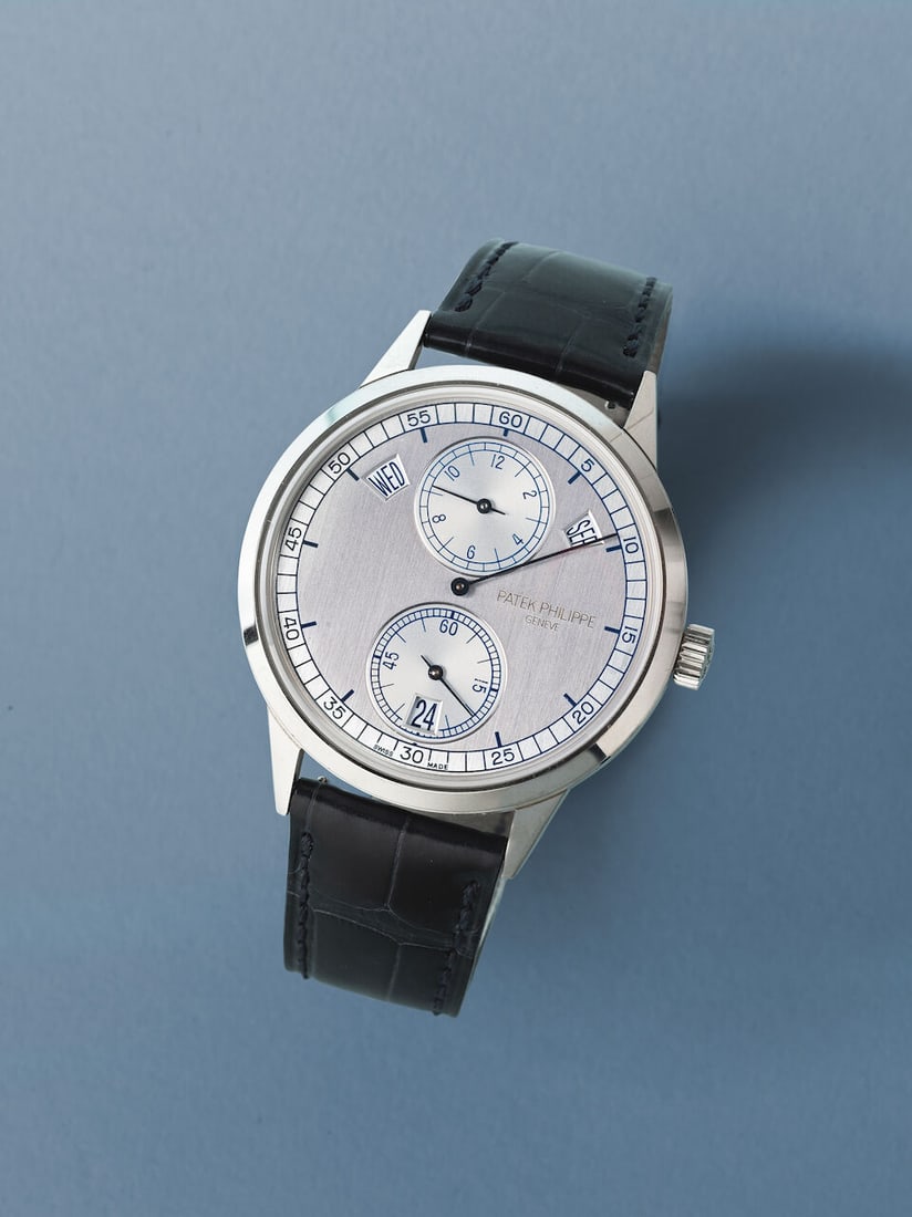 Patek Philippe. A very fine and rare 18K white gold automatic annual calendar wristwatch Patek P... - 2