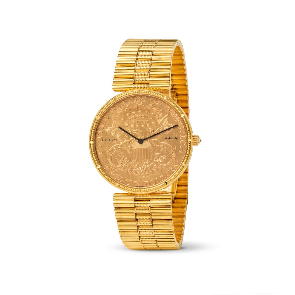 Corum. An 18K gold automatic bracelet watch Corum. Montre bracelet en or jaune 18K (750) mouveme...: Corum. An 18K gold automatic bracelet watch Corum. Montre bracelet en or jaune 18K (750) mouvement automatique Model: US 20 Dollar coin 1895 Date: Circa 1990 Movement: Jewelled automatic Dial: Dollar