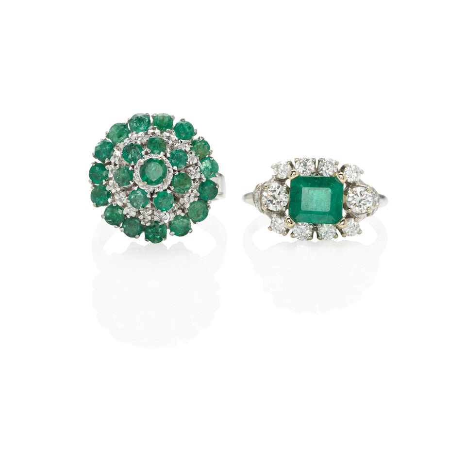 TWO GOLD, EMERALD AND DIAMOND RINGS: TWO GOLD, EMERALD AND DIAMOND RINGS • One ring of 14k white gold with 1 rectangular-shaped emerald (6.50 x 7.45 x 5.31 mm) weighing approximately 2.20 carats and 16 round-cut diamonds weighing