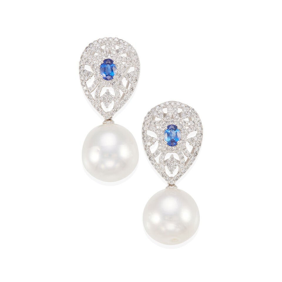 18K GOLD, DIAMOND, SAPPHIRE AND SOUTH SEA DROP EARRINGS: 18K GOLD, DIAMOND, SAPPHIRE AND SOUTH SEA DROP EARRINGS • 18k white gold • 208 round diamonds stated to weigh 1.24 carat total • 2 oval sapphires stated to weigh 0.92 carat