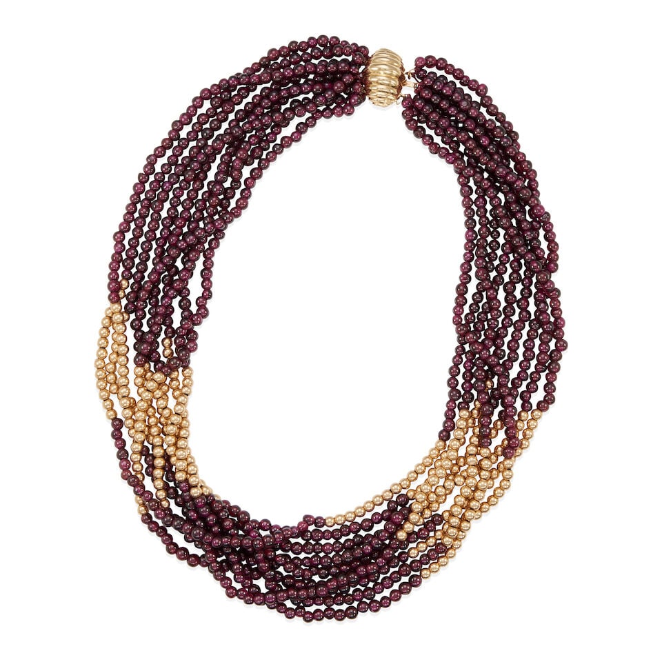 14K GOLD AND GARNET BEAD NECKLACE: 14K GOLD AND GARNET BEAD NECKLACE • 14k yellow gold • 9 strands of round garnet and gold beads measuring approximately 6.95 - 4.25 mm • Length 18 in. • Estimated gross weight: