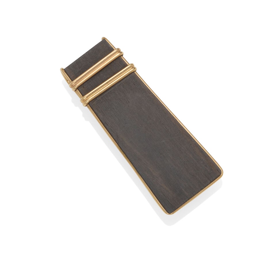 ALLAN ADLER: 14K GOLD AND EBONY MONEY CLIP: ALLAN ADLER: 14K GOLD AND EBONY MONEY CLIP • 14k yellow gold • 1 piece of ebony wood • Signed 'ALLAN ADLER' and stamped 'HANDMADE' and '208' • Measures 2 ¼ x ⅞