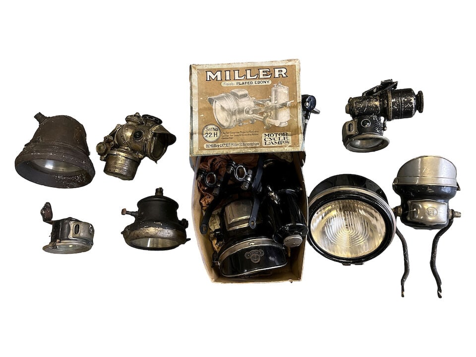 A quantity of vintage lighting: A quantity of vintage lighting including a believed NOS Miller 22H acetylene headlamp, mounting bracket and generator - in original box; a Bosch continental electric headlamp with dipswitch attached; 