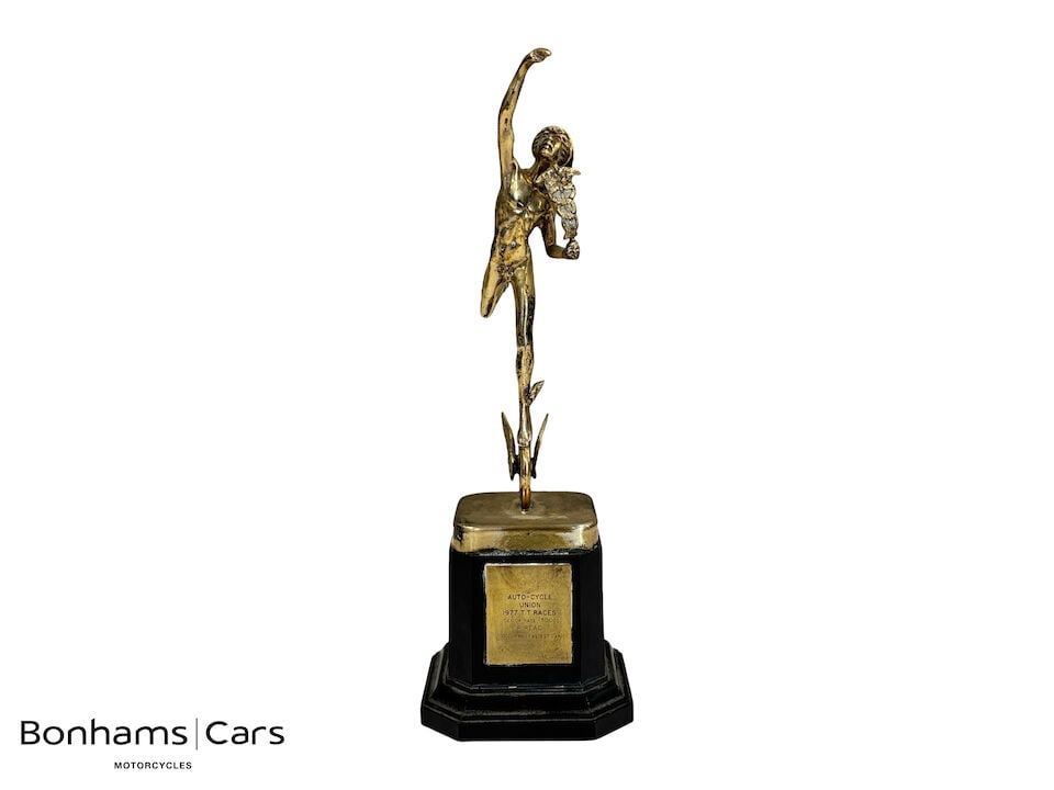 Phil Read - An Isle of Man 1977 Senior TT Fastest Lap trophy: Phil Read - An Isle of Man 1977 Senior TT Fastest Lap trophy awarded to Phil Read riding his Suzuki, depicting the Mercury figure with a caduceus, mounted on a black wooden base applied with plaque in