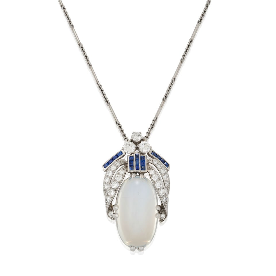 A MOONSTONE, SAPPHIRE, AND DIAMOND PENDANT: A MOONSTONE, SAPPHIRE, AND DIAMOND PENDANT Centering an oval cabochon moonstone measuring approximately 24.00 x 13.60 x 9.05 mm, the moonstone with signature plaque for Tiffany & Co. to reverse, with