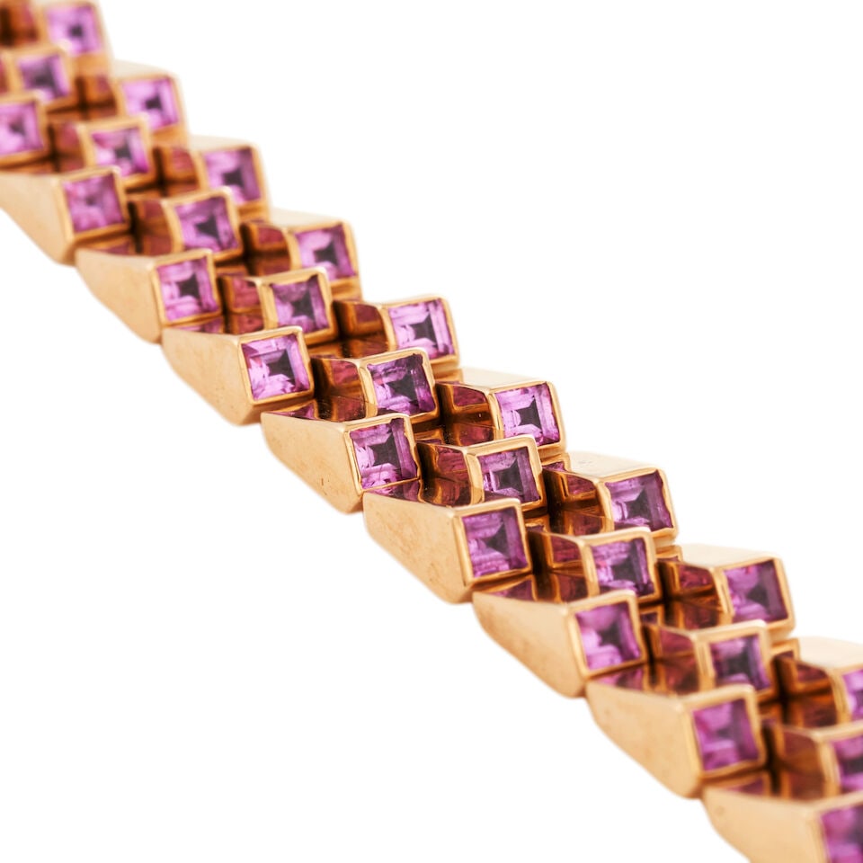 HAMMERMAN BROTHERS: AN 18K ROSE GOLD AND PINK SAPPHIRE ESCALATOR BRACELET: HAMMERMAN BROTHERS: AN 18K ROSE GOLD AND PINK SAPPHIRE ESCALATOR BRACELET Composed of a series of brick-style links, the terminals each set with a bezel-set step-cut pink sapphire, weight 39.9 dwt, 