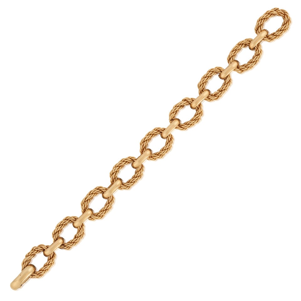 TIFFANY & CO.: A 14K GOLD BRACELET, CIRCA 1970s: TIFFANY & CO.: A 14K GOLD BRACELET, CIRCA 1970s Composed of ropetwist and polished links, weight 25.5 dwt, signed Tiffany, boxed, length 7 1/2 in. For further information on this lot please visit