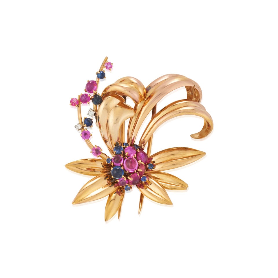 MAUBOUSSIN: AN 18K GOLD, SAPPHIRE, RUBY, AND DIAMOND BROOCH, FRANCE, CIRCA 1940s: MAUBOUSSIN: AN 18K GOLD, SAPPHIRE, RUBY, AND DIAMOND BROOCH, FRANCE, CIRCA 1940s The stylized flower set with cabochon and circular-cut sapphires and rubies, and full-cut diamonds, weight 14.3 dwt, s