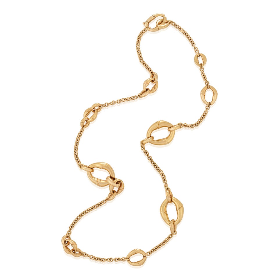 GUCCI: AN 18K GOLD NECKLACE, ITALY: GUCCI: AN 18K GOLD NECKLACE, ITALY The station necklace with various oval-shaped bamboo motif links, weight 28.2 dwt, signed Gucci, length 27 3/4 in. For further information on this lot please