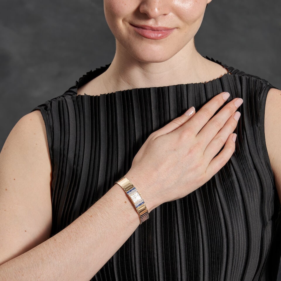 CARTIER: A 14K GOLD, SAPPHIRE, AND DIAMOND WRISTWATCH, CIRCA 1950 - 2