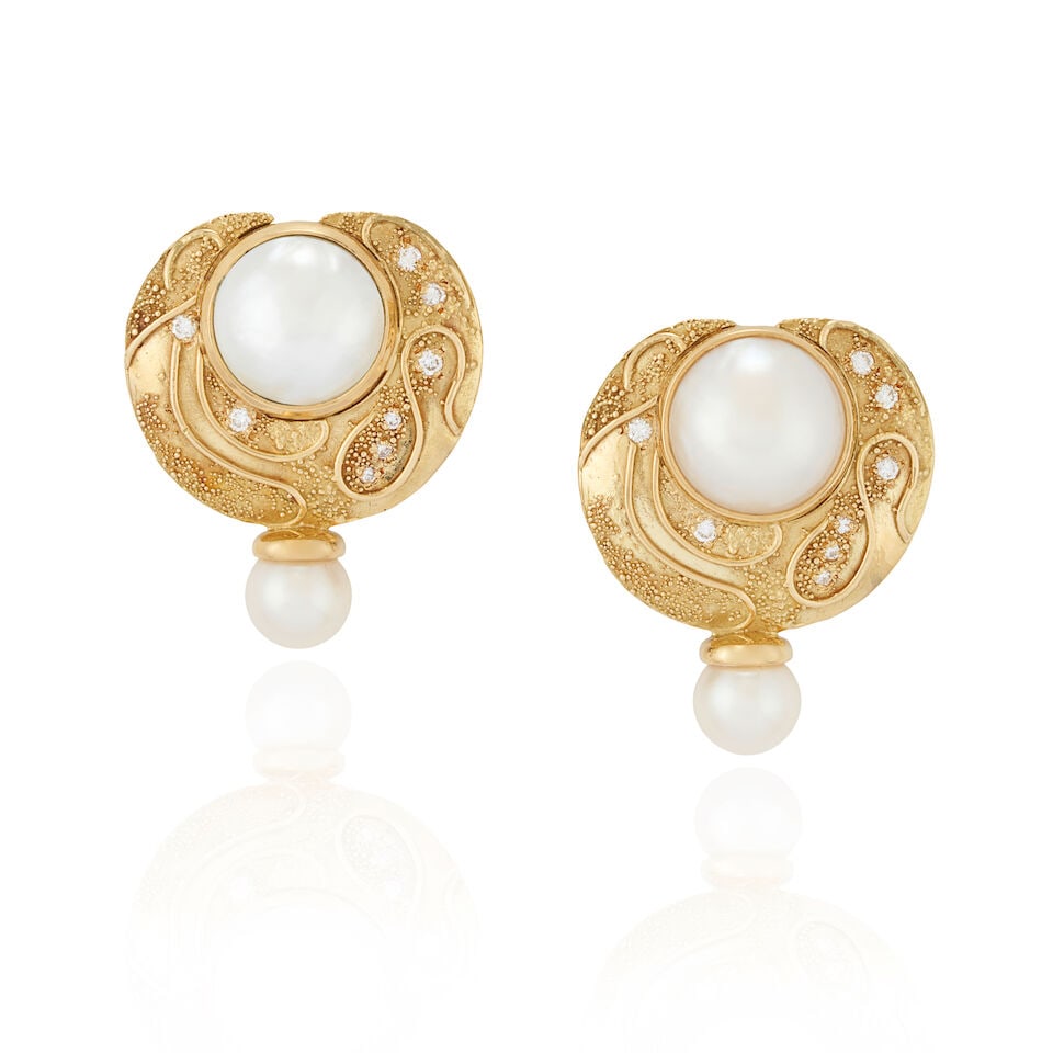 ELIZABETH GAGE: A PAIR OF 18K GOLD, MABÉ PEARL, CULTURED PEARL, AND DIAMOND 'SHIRAZ' EARCLI...: ELIZABETH GAGE: A PAIR OF 18K GOLD, MABÉ PEARL, CULTURED PEARL, AND DIAMOND 'SHIRAZ' EARCLIPS, ENGLAND Each textured gold disc set with a mabé pearl, measuring approximately 14.30 mm, and