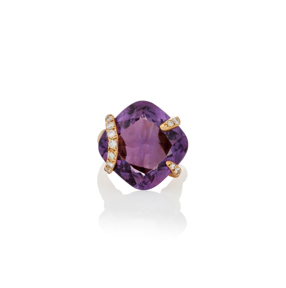 CHANEL: AN 18K GOLD, AMETHYST, AND DIAMOND RING, FRANCE: CHANEL: AN 18K GOLD, AMETHYST, AND DIAMOND RING, FRANCE Centering a large fancy-cut amethyst, measuring approximately 19.60 x 19.60 x 8.80 mm, with full-cut diamond accents, and twisted shank, weight
