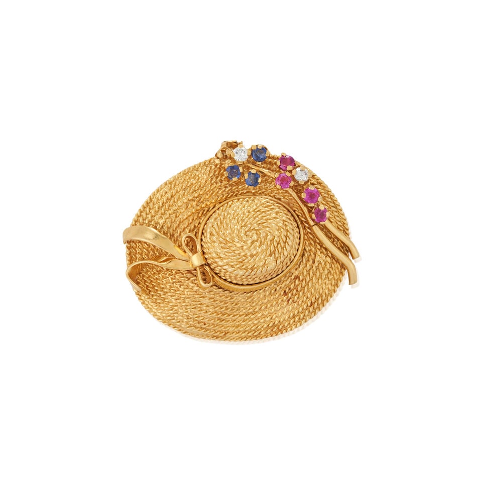 A CHARMING 18K GOLD, SAPPHIRE, RUBY, AND DIAMOND HAT BROOCH: A CHARMING 18K GOLD, SAPPHIRE, RUBY, AND DIAMOND HAT BROOCH Set with circular-cut sapphires and rubies, and full-cut diamonds, weight 12.9 dwt, length 1 5/8 in. For further information on this lot