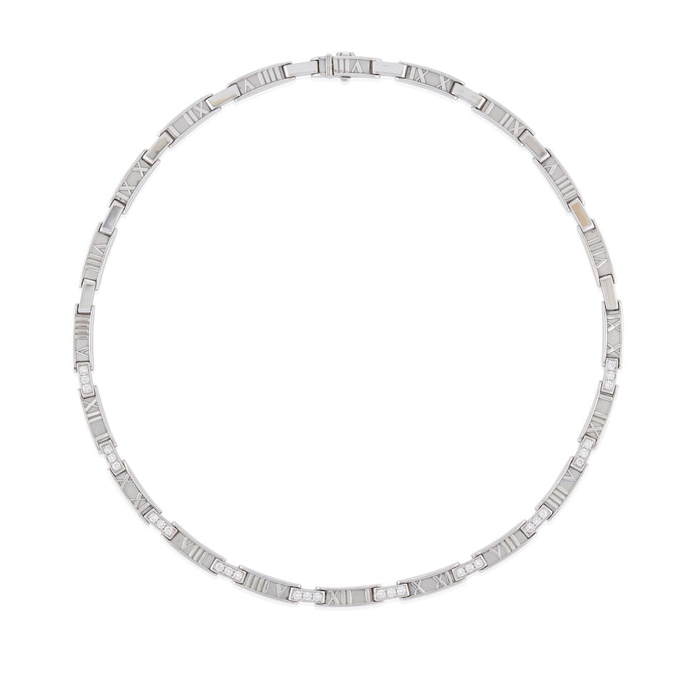 TIFFANY & CO.: AN 18K WHITE GOLD AND DIAMOND 'ATLAS' NECKLACE, ITALY: TIFFANY & CO.: AN 18K WHITE GOLD AND DIAMOND 'ATLAS' NECKLACE, ITALY The links with Roman numerals, and full-cut diamond accents, weight 40.4 dwt, signed Tiffany & Co., Italy, length 16 1/4 in.