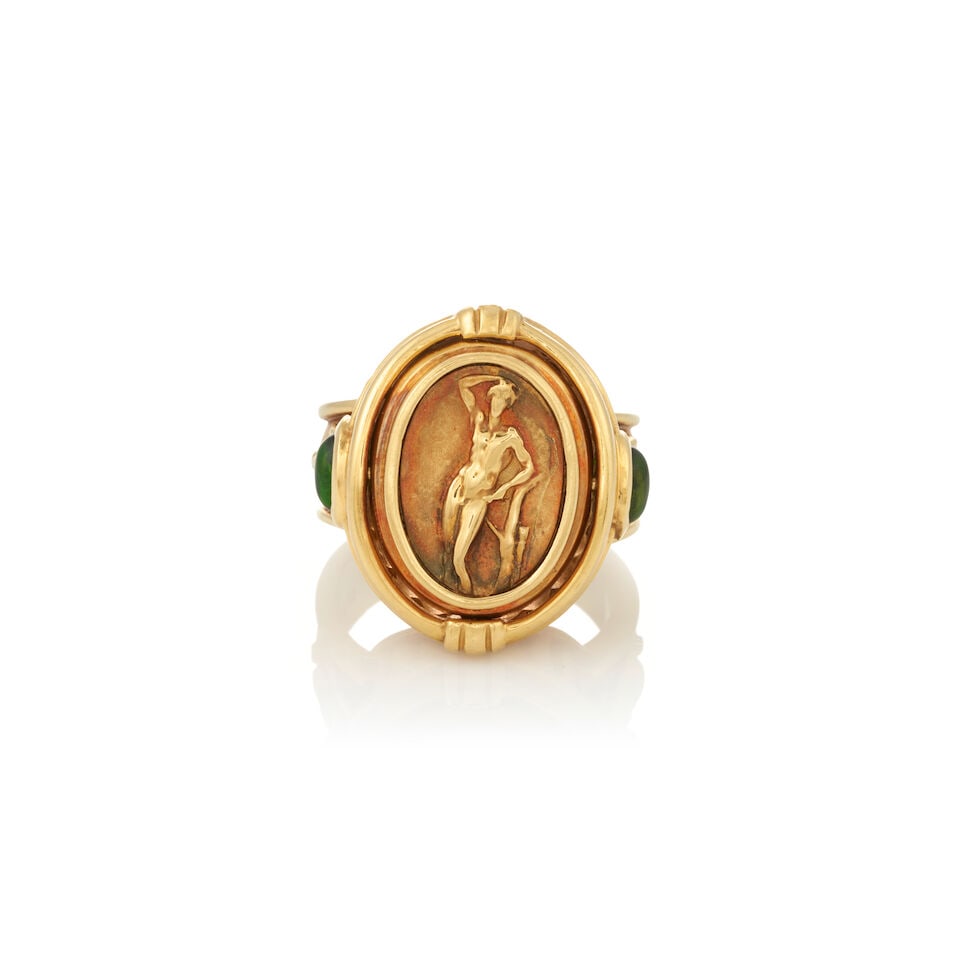 SEIDENGANG: AN 18K GOLD, AMETHYST, AND GREEN TOURMALINE FLIP RING: SEIDENGANG: AN 18K GOLD, AMETHYST, AND GREEN TOURMALINE FLIP RING The hinged center set with an oval cabochon amethyst to one side, and a relief of a heroic male nude to the other, within a fluted