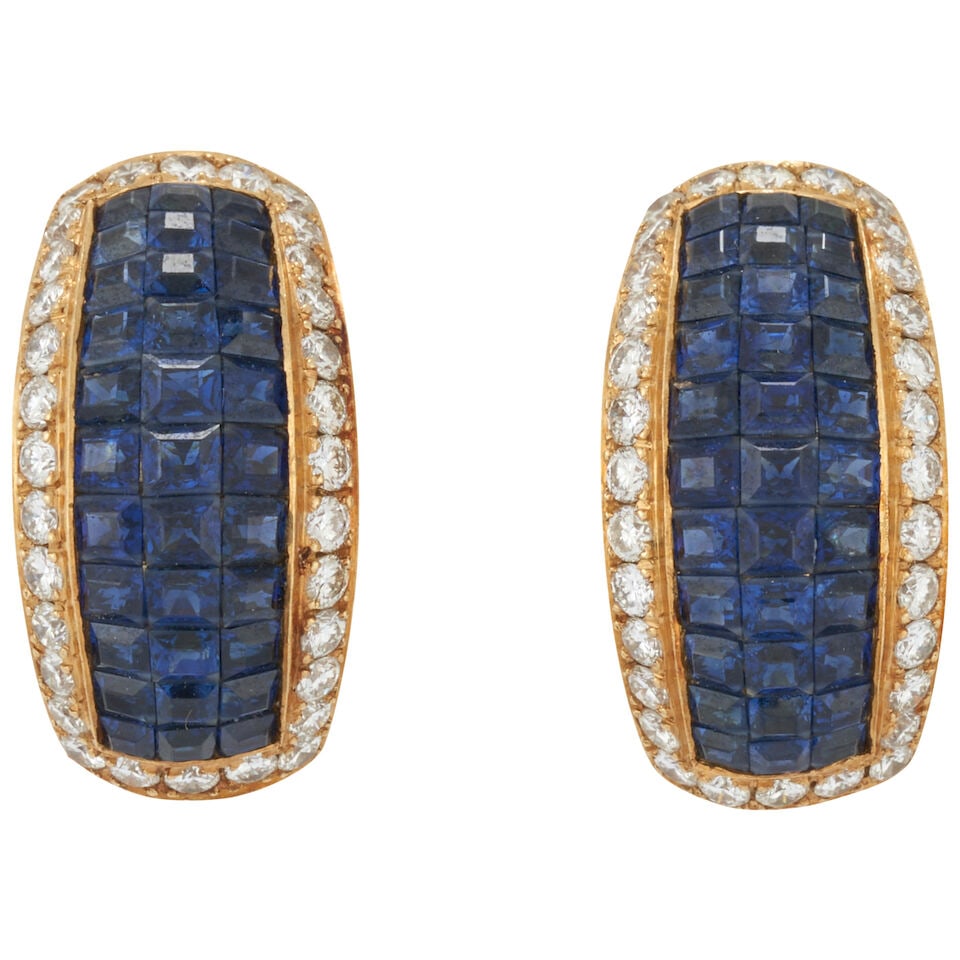 A PAIR OF 18K GOLD, SAPPHIRE, AND DIAMOND EARRINGS: A PAIR OF 18K GOLD, SAPPHIRE, AND DIAMOND EARRINGS The channel-set sapphires framed by full-cut diamonds, approximate total diamond weight 1.15 carats, weight 9.5 dwt, length 13/16 in. For further