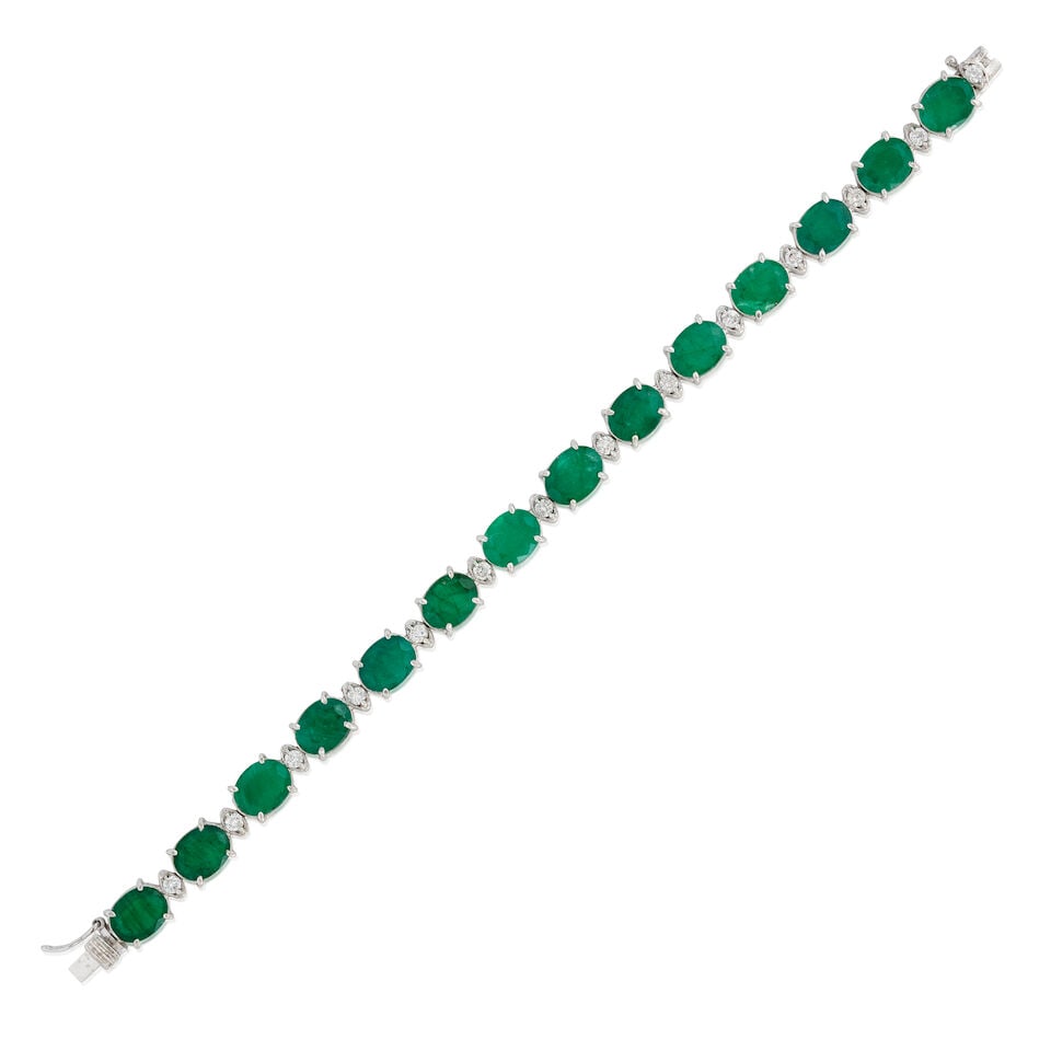 A 14K WHITE GOLD, EMERALD, AND DIAMOND BRACELET: A 14K WHITE GOLD, EMERALD, AND DIAMOND BRACELET Composed of alternating fancy-cut emeralds, total weight 25.64 carats, and full-cut diamonds, total diamond weight 1.00 carat, weight 12.5 dwt, length