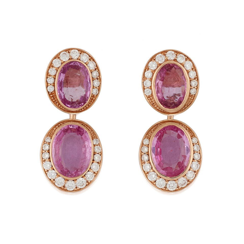 A PAIR OF ROSE GOLD, PINK SAPPHIRE, AND DIAMOND DAY/NIGHT EARRINGS: A PAIR OF ROSE GOLD, PINK SAPPHIRE, AND DIAMOND DAY/NIGHT EARRINGS The bezel-set fancy-cut pink sapphire tops suspending a removeable pink sapphire drop, total weight 4.40 carats, each framed by full-