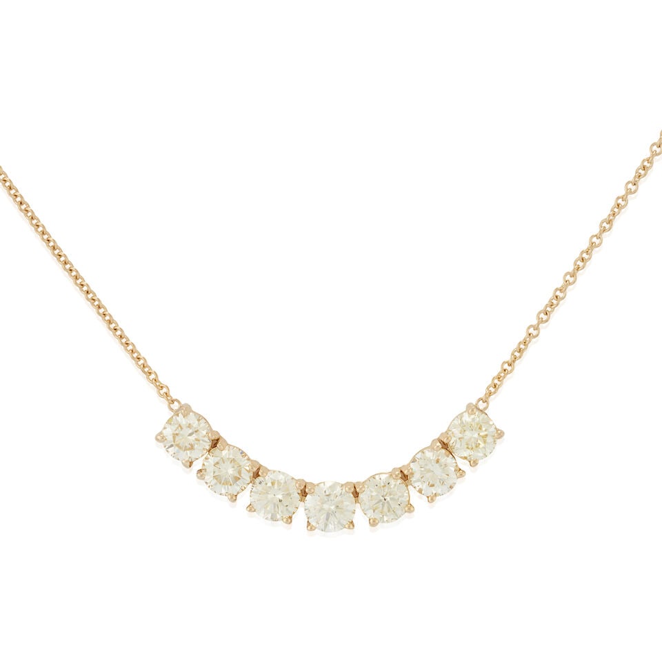 A GOLD AND DIAMOND PENDANT NECKLACE: A GOLD AND DIAMOND PENDANT NECKLACE Centering seven full-cut diamonds, total weight 5.02 carats, set in 14k gold and joined to an 18k gold chain, weight 4.8 dwt, length 19 1/2 in. For further