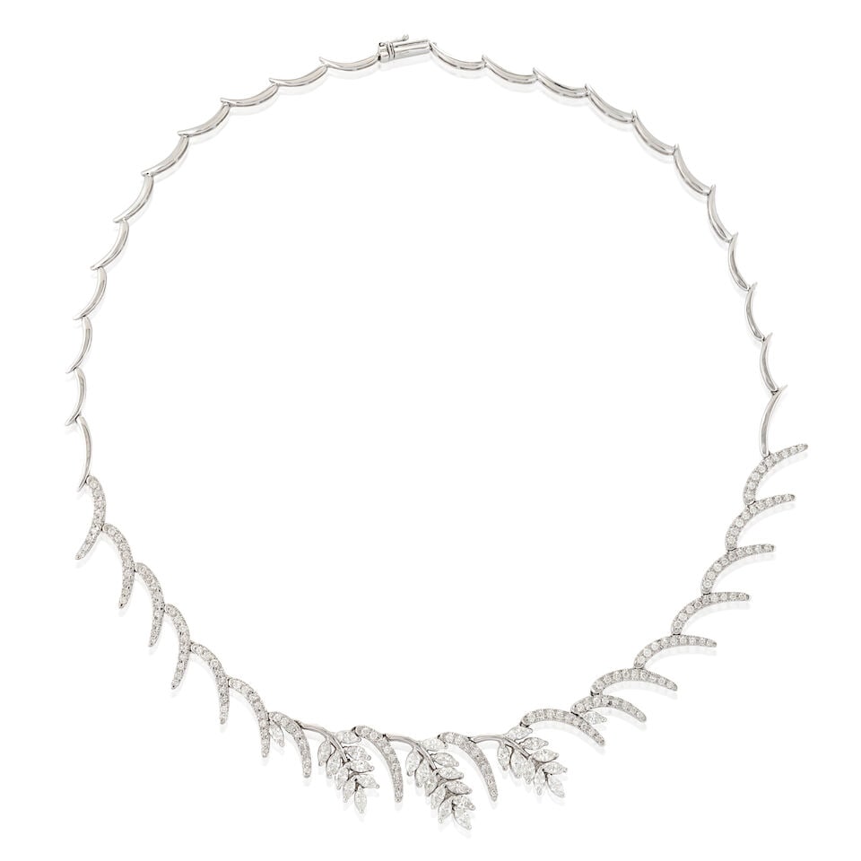 AN 18K WHITE GOLD AND DIAMOND NECKLACE: AN 18K WHITE GOLD AND DIAMOND NECKLACE The foliate motifs set full and marquise-cut diamonds, approximate total weight 4.28 carats, weight 16.6 dwt, length 16 3/4 in. For further information on