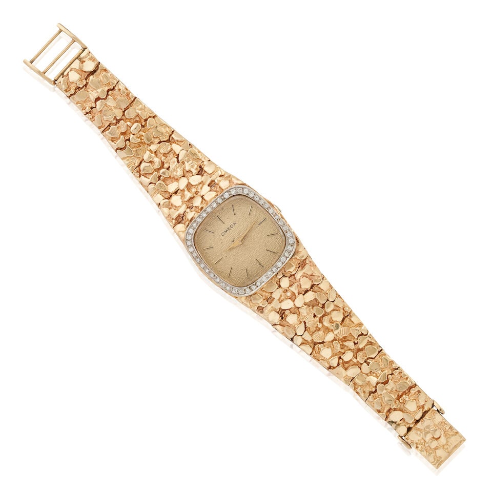 OMEGA: A 14K GOLD AND DIAMOND WRISTWATCH (1 of 5)
