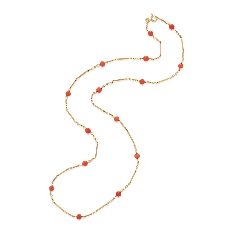 A 14K GOLD AND CORAL NECKLACE: A 14K GOLD AND CORAL NECKLACE The fancy link chain set with coral beads, ranging in size from approximately 4.75 to 5.00 mm, weight 5.6 dwt, length 24 1/2 in. Footnotes: Please note this item cannot