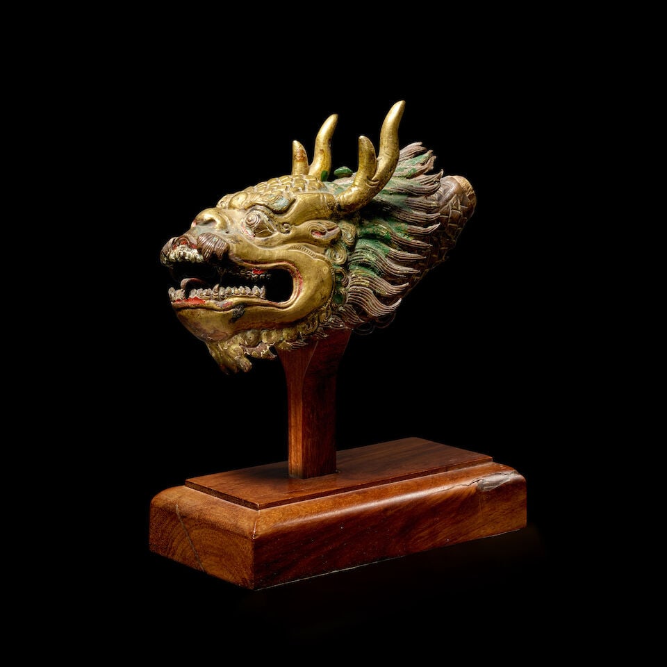 A GILT COPPER ALLOY REPOUSSE DRAGON HEAD TIBET, 18TH/19TH CENTURY (1 of 1)